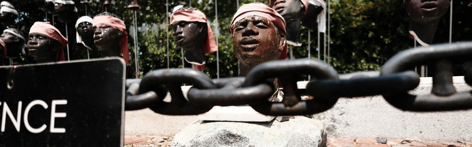 Outdoor art piece depicting the severed heads of enslaved Africans