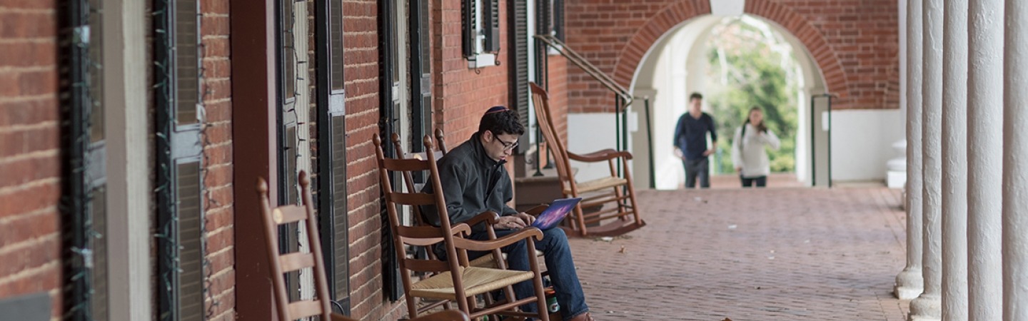 Student studying in the halls of the lawn 